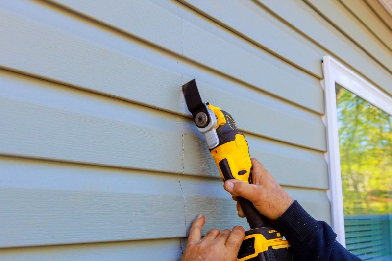 New Vinyl Siding Panel Installation